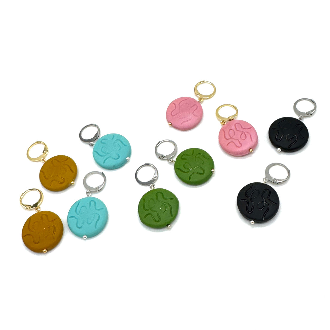 Set of colorful keychains with different designs on a white background