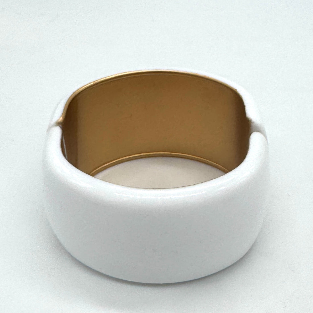 white lucite clamper cuff bracelet on a white background