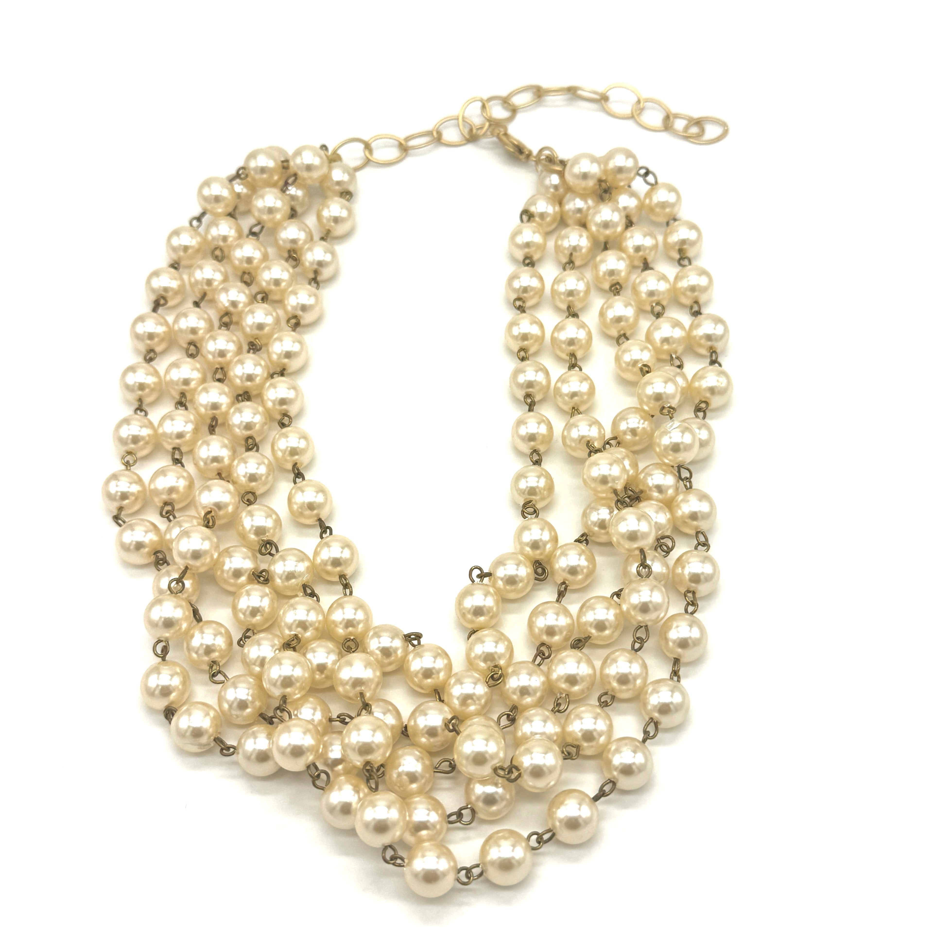 Multi-strand pearl necklace on a white background