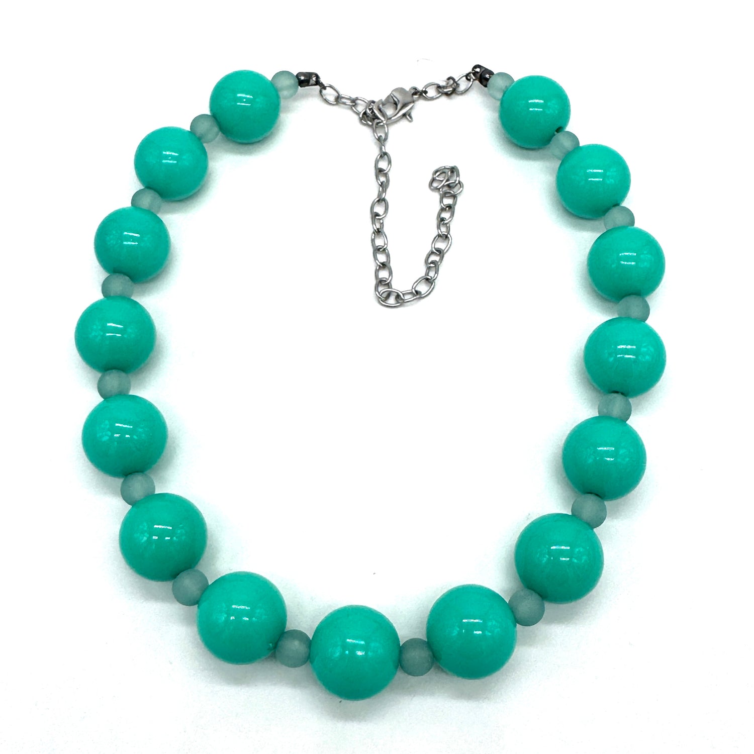 Turquoise beaded necklace on a white background