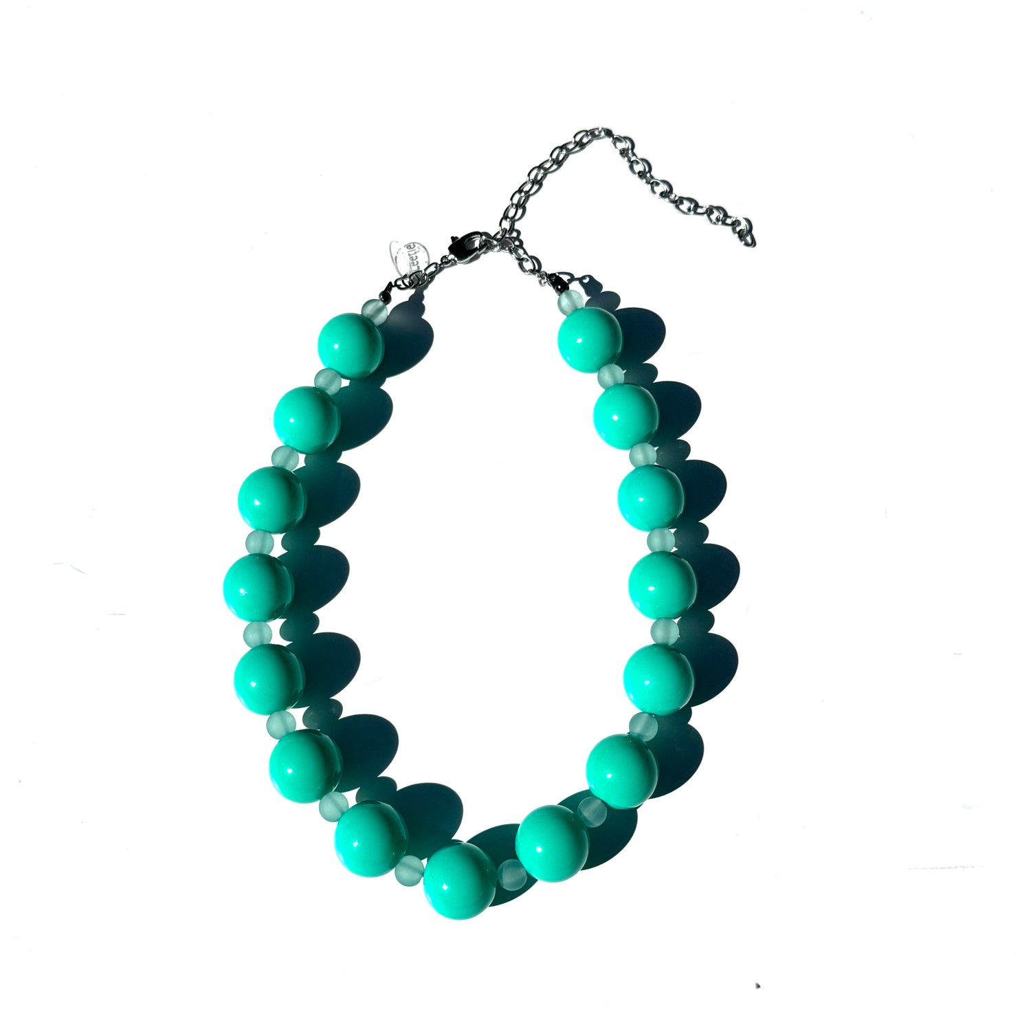 Turquoise beaded necklace on a white background