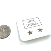 Star-shaped earrings on a card with &