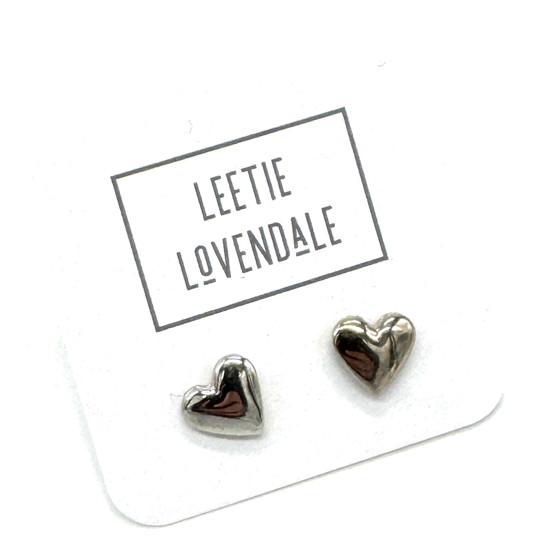 Heart-shaped earrings on a Leettie Lovendale branded card