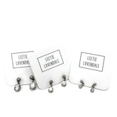 Pairs of earrings on display cards with &