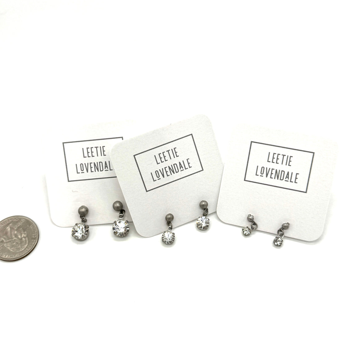 Set of earrings on display with &