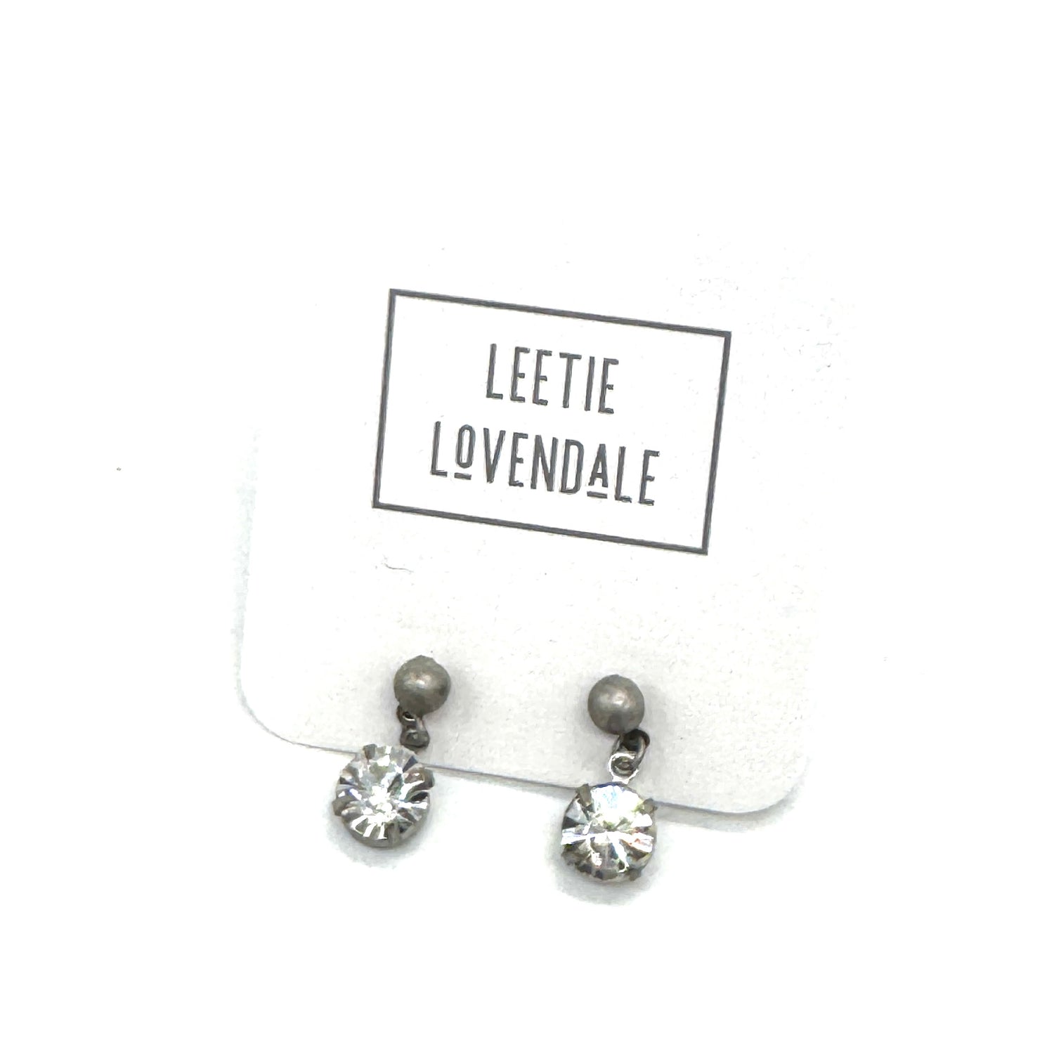 Pair of earrings on a card with &