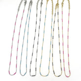 Set of 6 necklaces in different colors on a white background