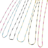 Set of multicolored beaded necklaces on a white background