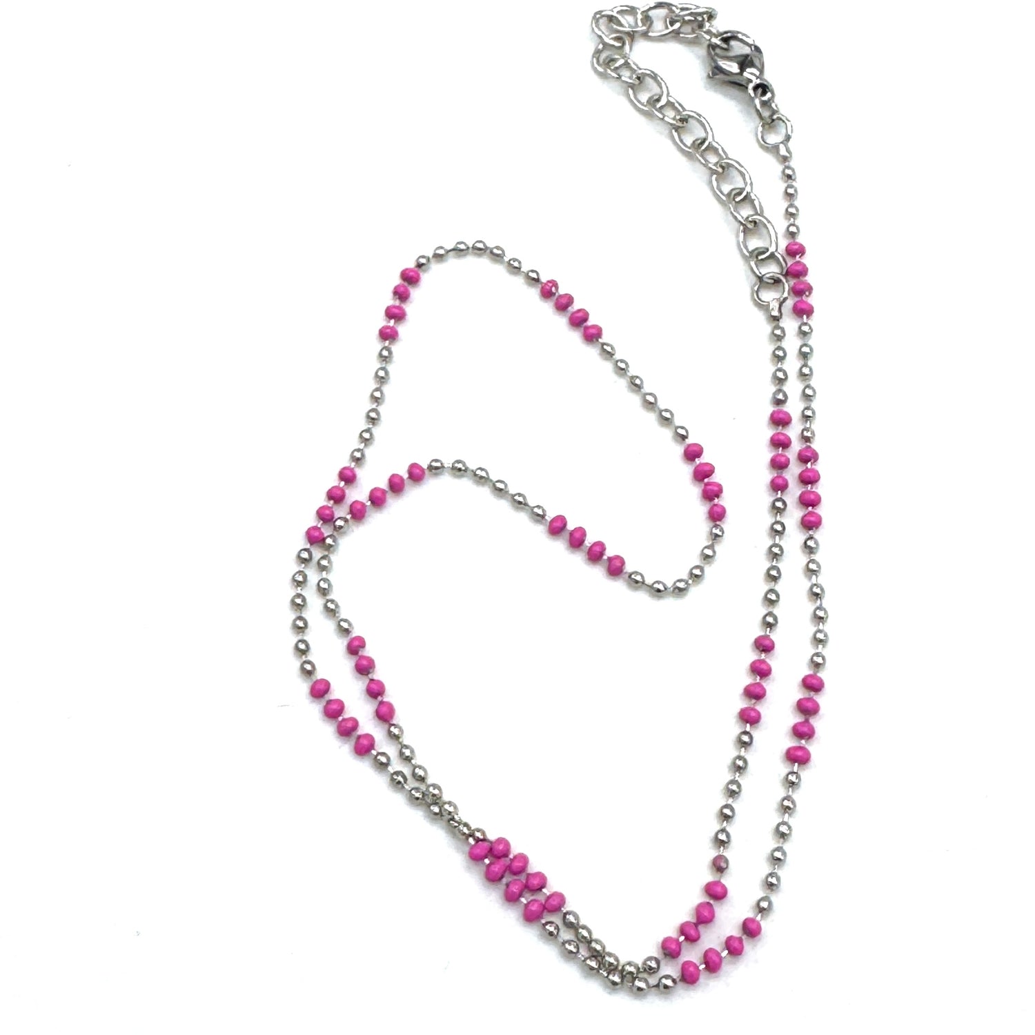 Necklace with pink and silver beads on a white background