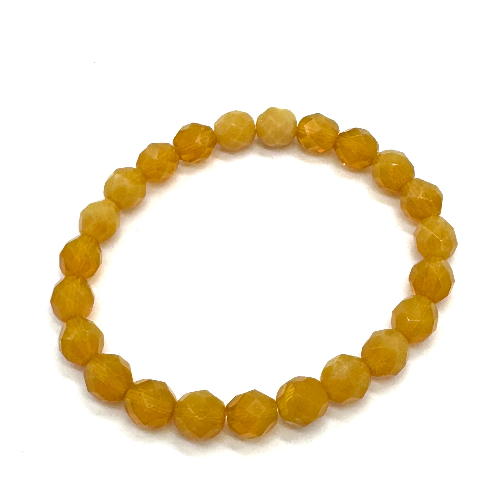 Yellow beaded bracelet on a white background