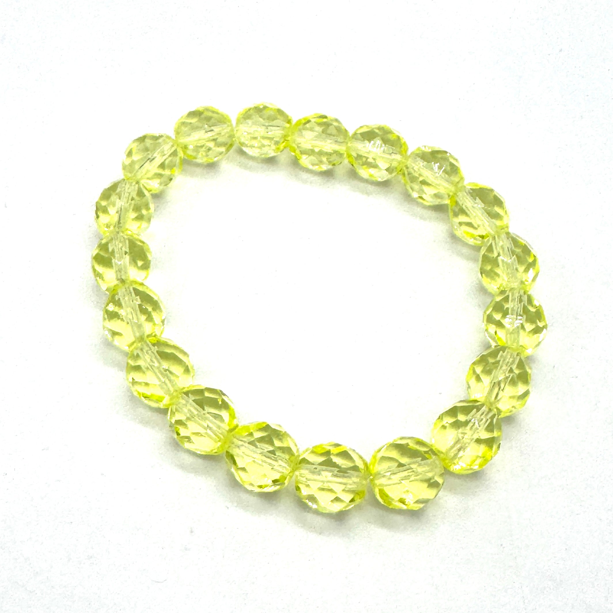 Yellow beaded bracelet on a white background