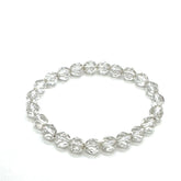 Clear beaded bracelet on a white background