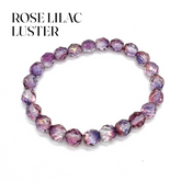Rose lilac luster beaded bracelet on a white background with text &