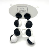 Black and white earrings on a Leetie Lovendale branded card