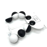 Black and white spherical earrings on a white background