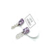 Pair of purple crystal earrings with silver chains on a white background, featuring a &