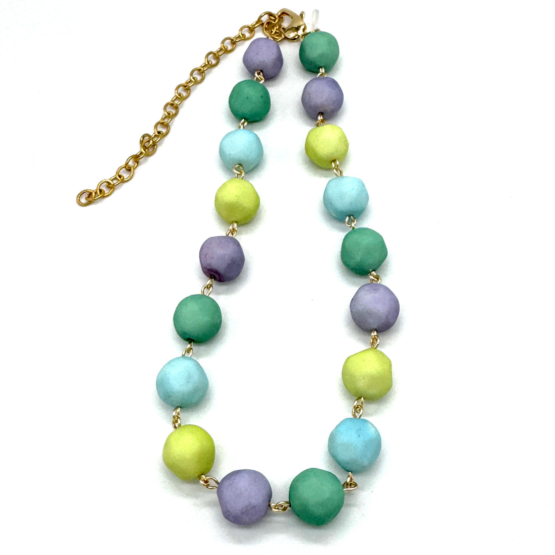 Necklace with pastel-colored beads on a white background