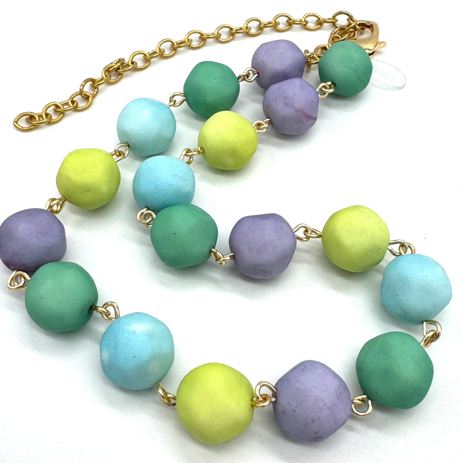 Necklace with colorful beads on a white background