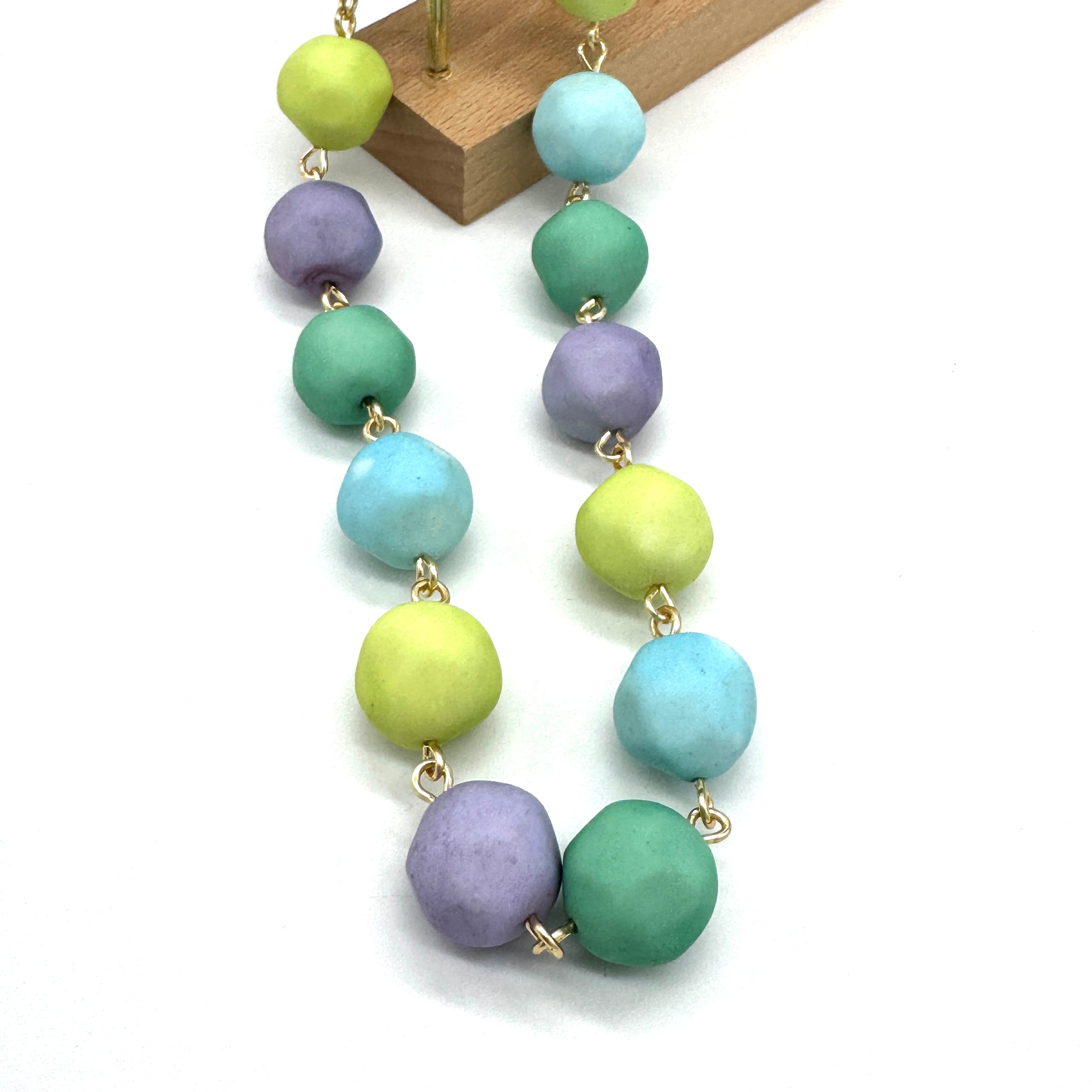 Necklace with colorful beads on a white background