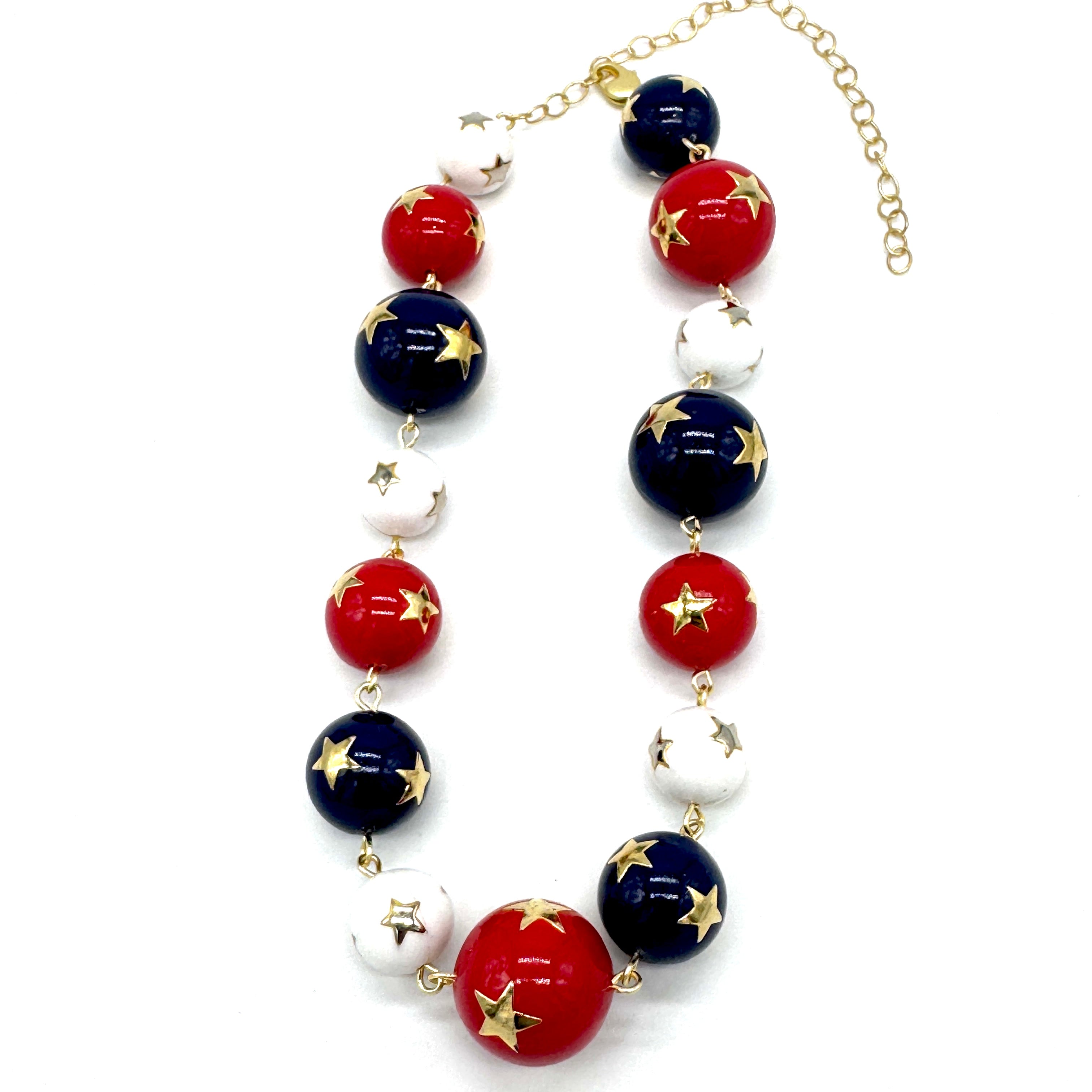 Necklace with red, blue, and white beads on a white background