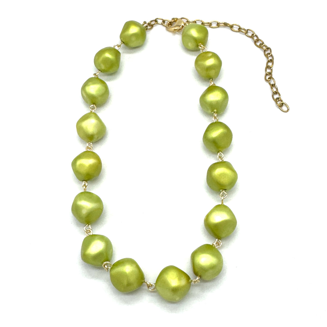 Green beaded necklace on a white background