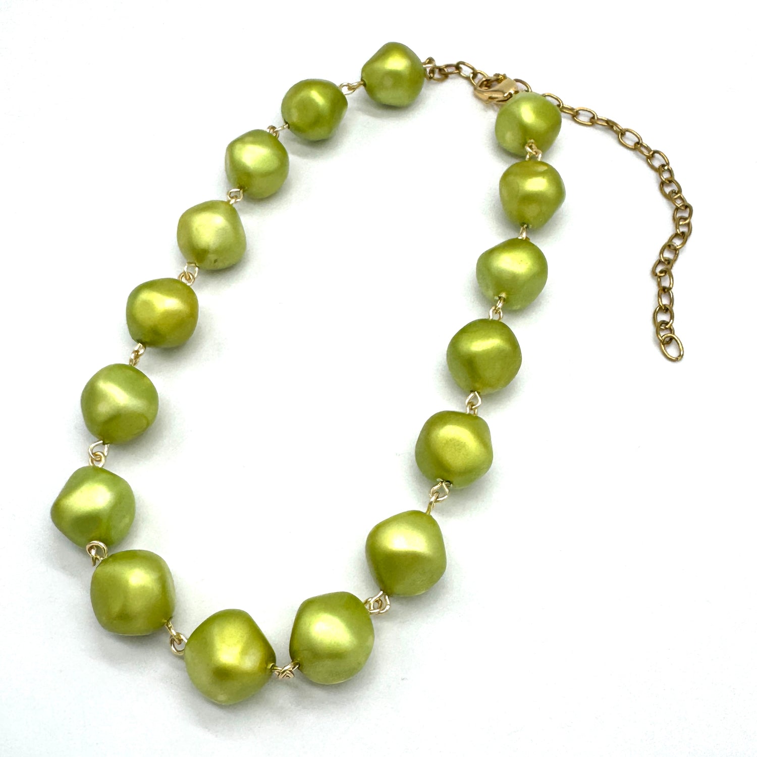 Green necklace on a white background