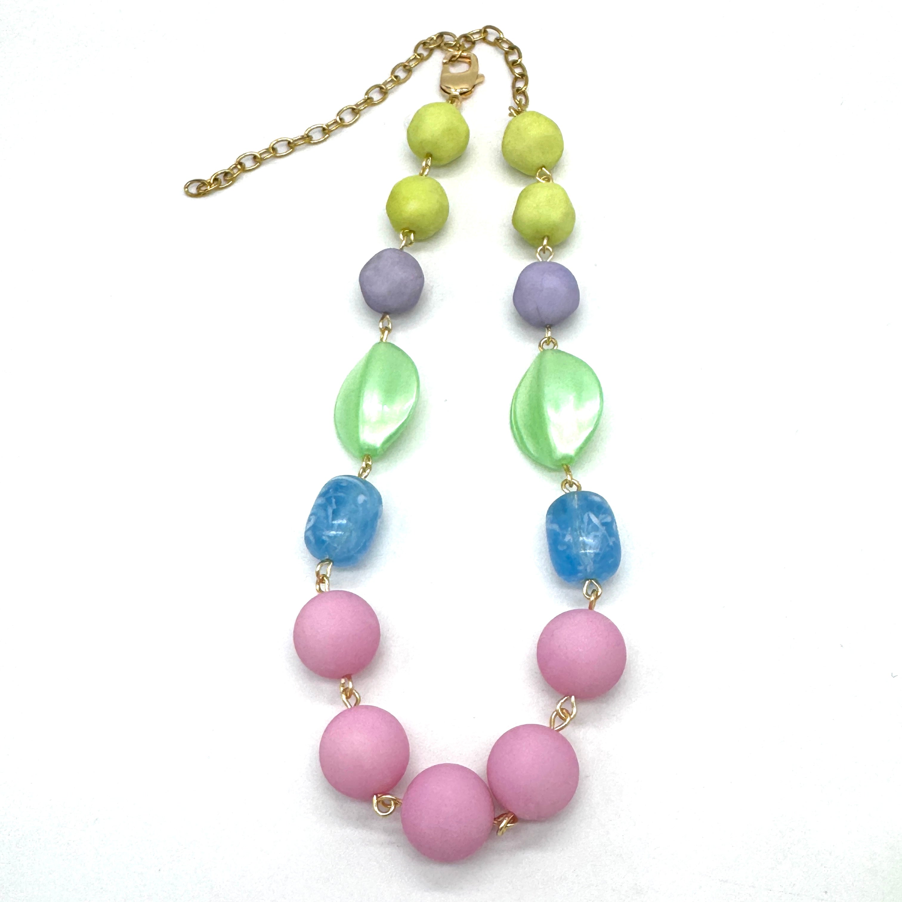 Necklace with colorful beads on a white background