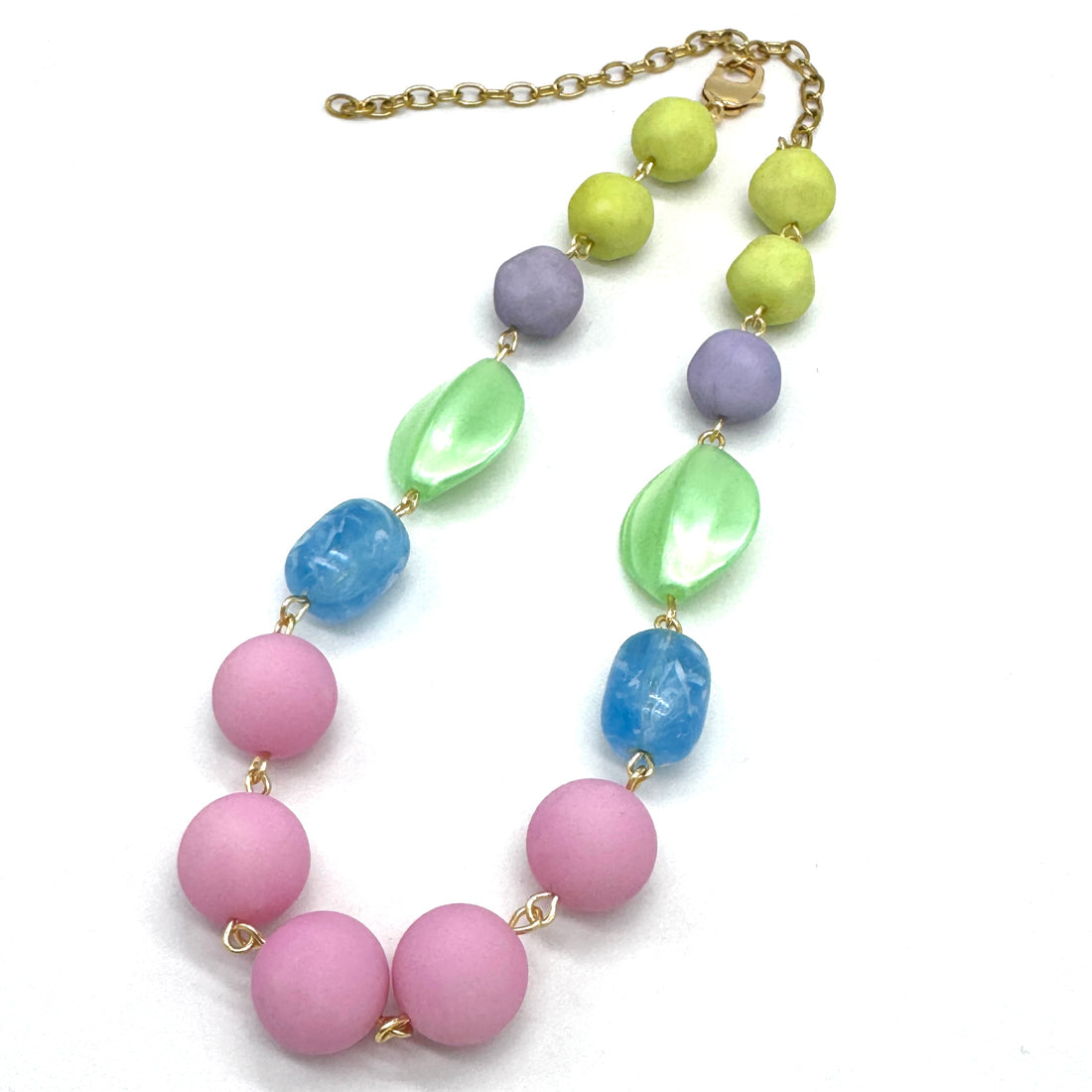 Necklace with pastel-colored beads on a white background
