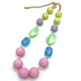 Necklace with pastel-colored beads on a white background