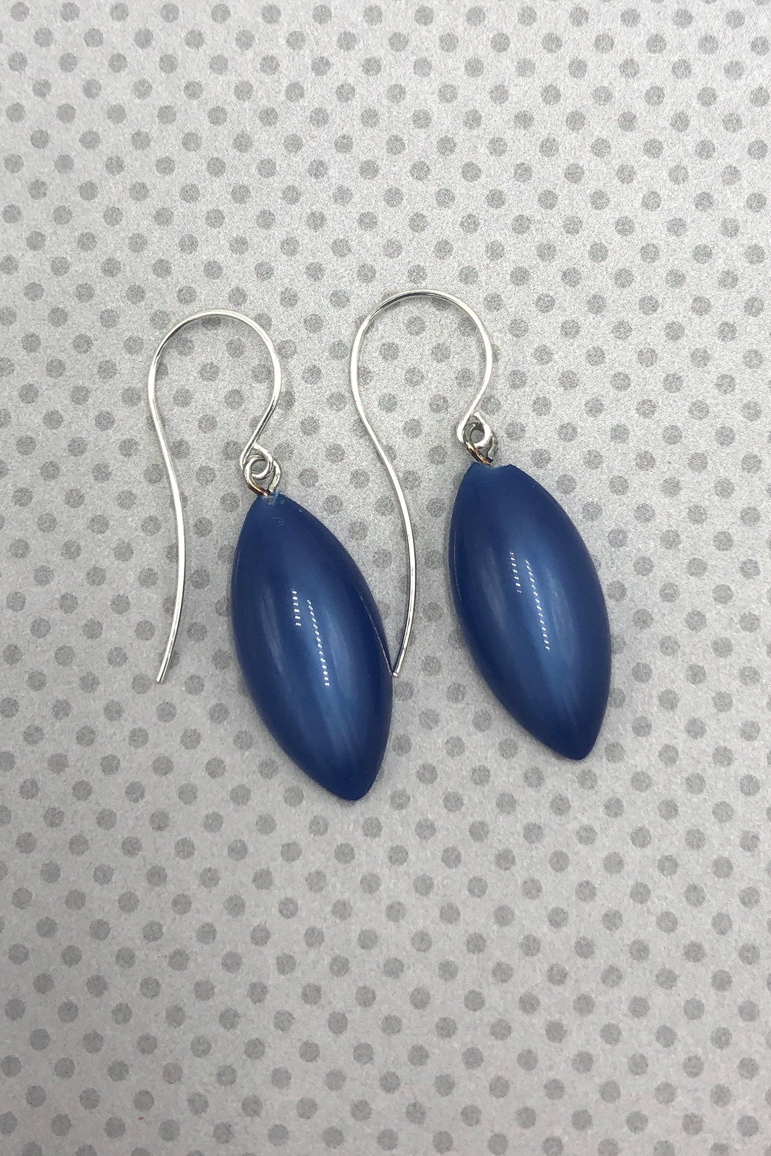 blue marquis shaped earring on fun bckground
