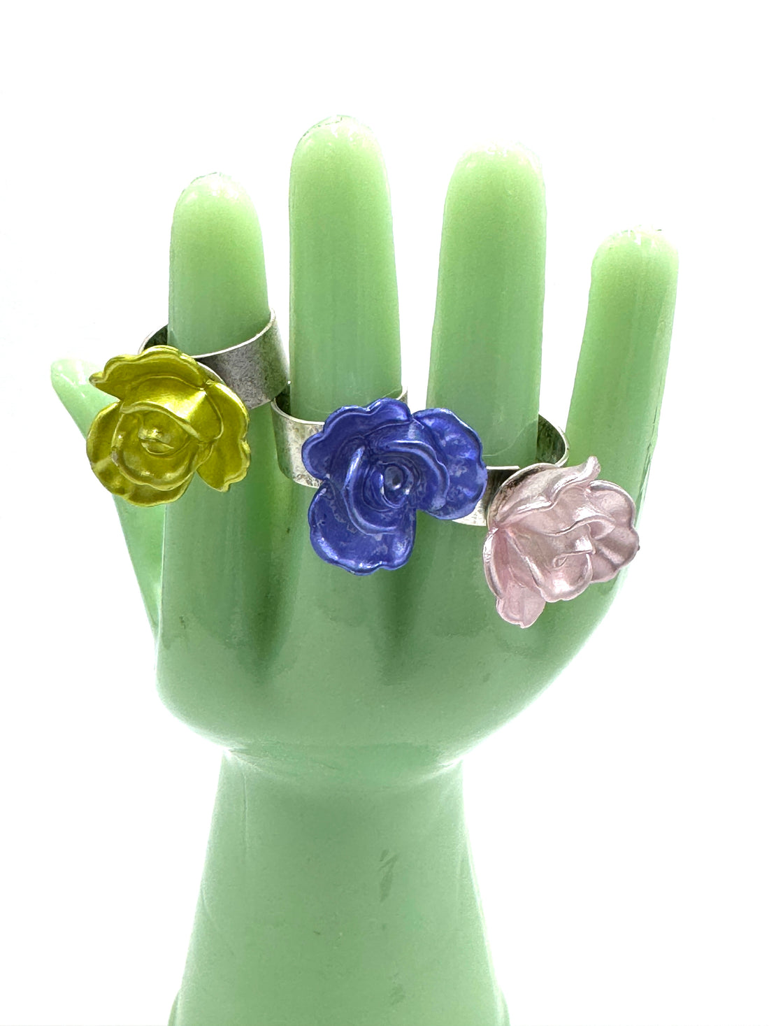 3 corsage rings on a green hand