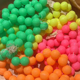 Colorful beaded strands in green, yellow, pink, and orange.