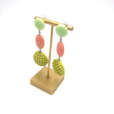 retro statement earrings on a stand