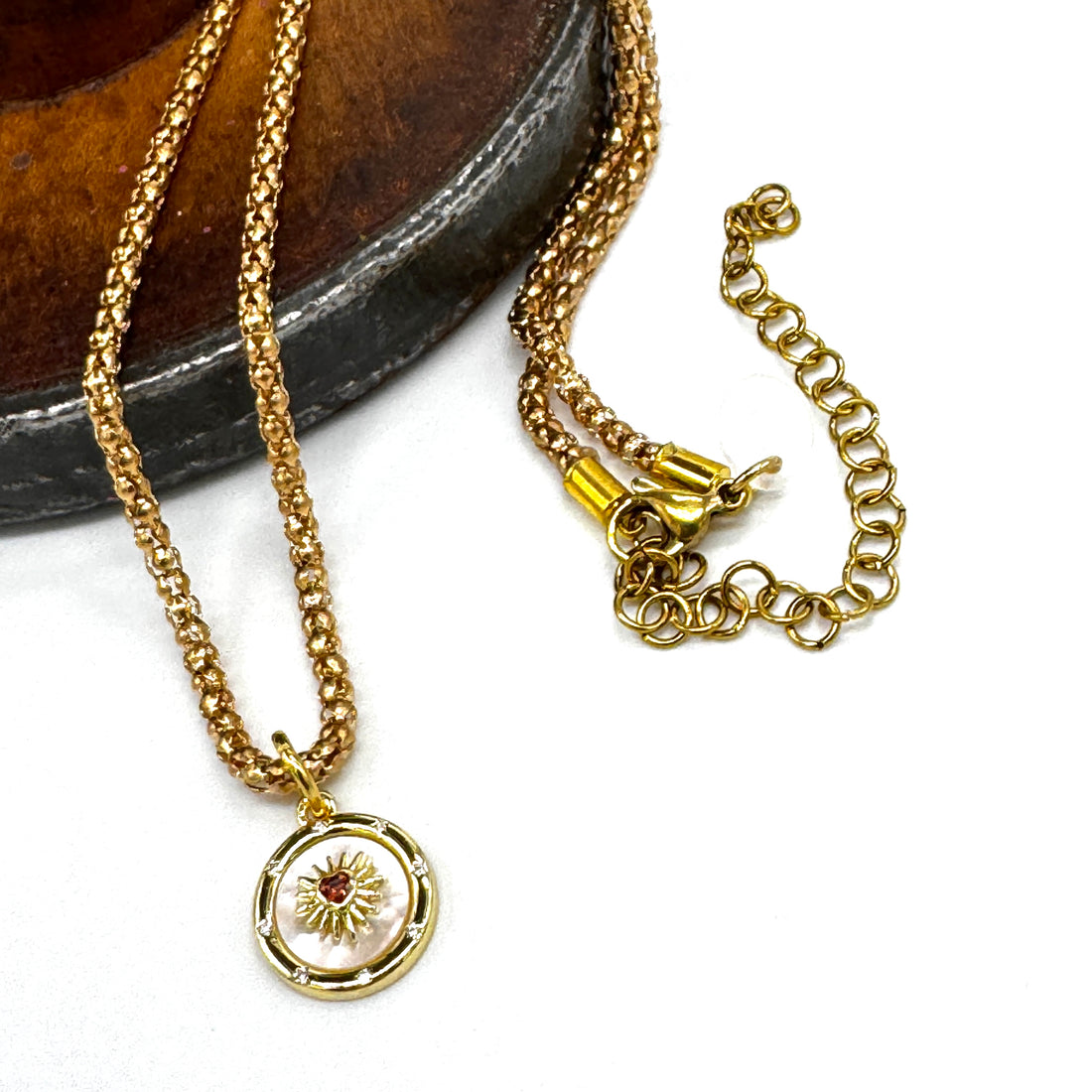 Gold necklace on a white background