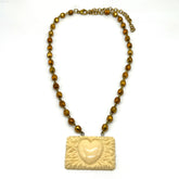 Necklace with heart-shaped pendant on a white background