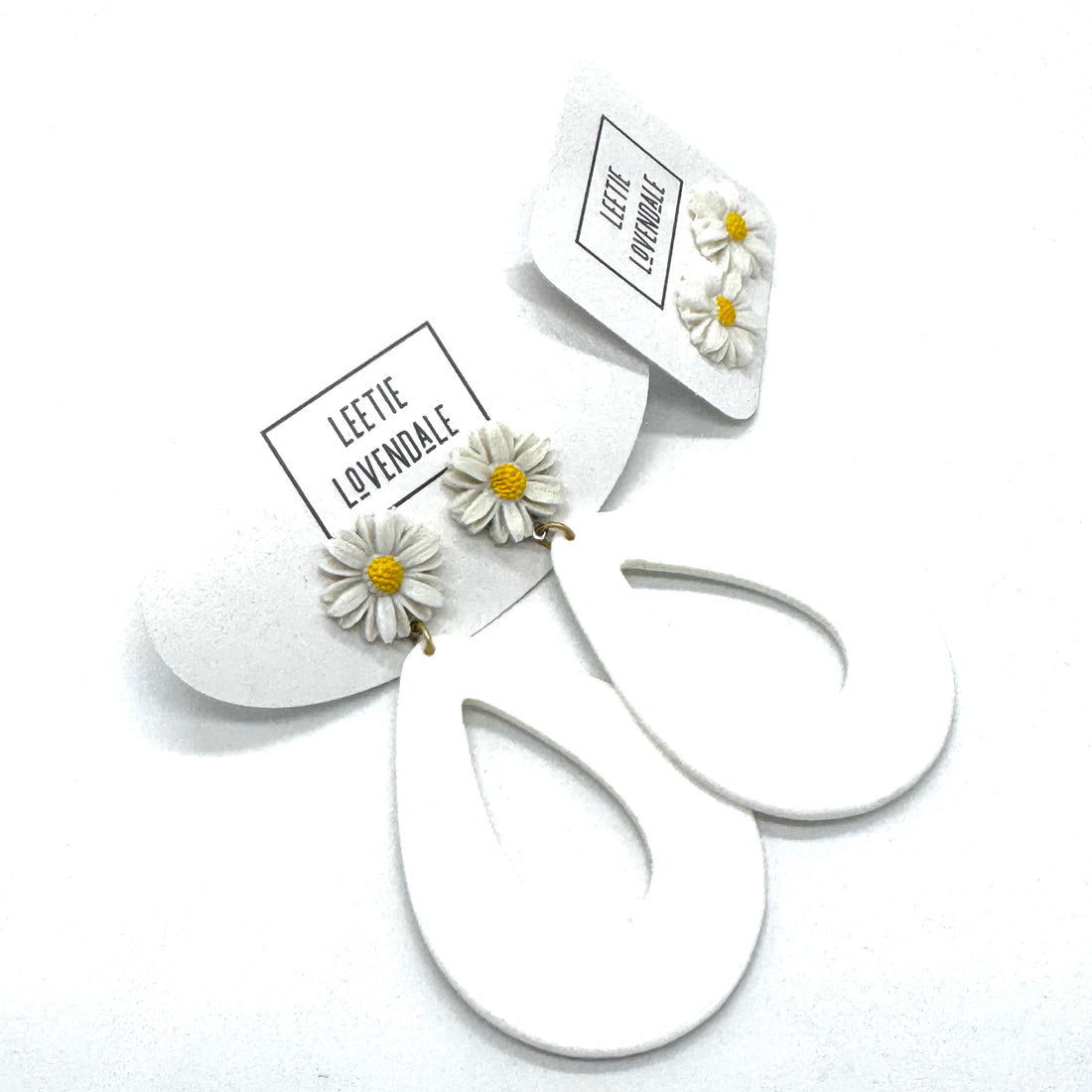 White floral earrings with &