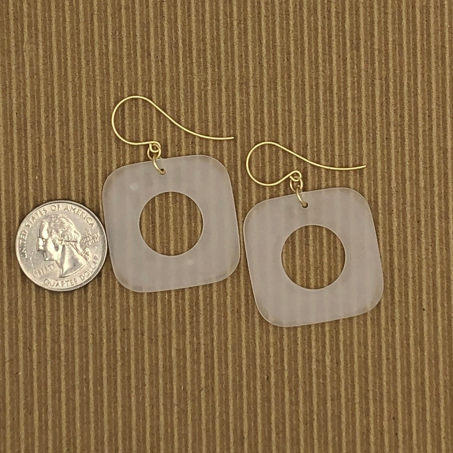 quarter in picture to show size of danger earrings