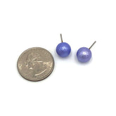 periwinkle pitted ball stud earrings with quarter next to them to show size