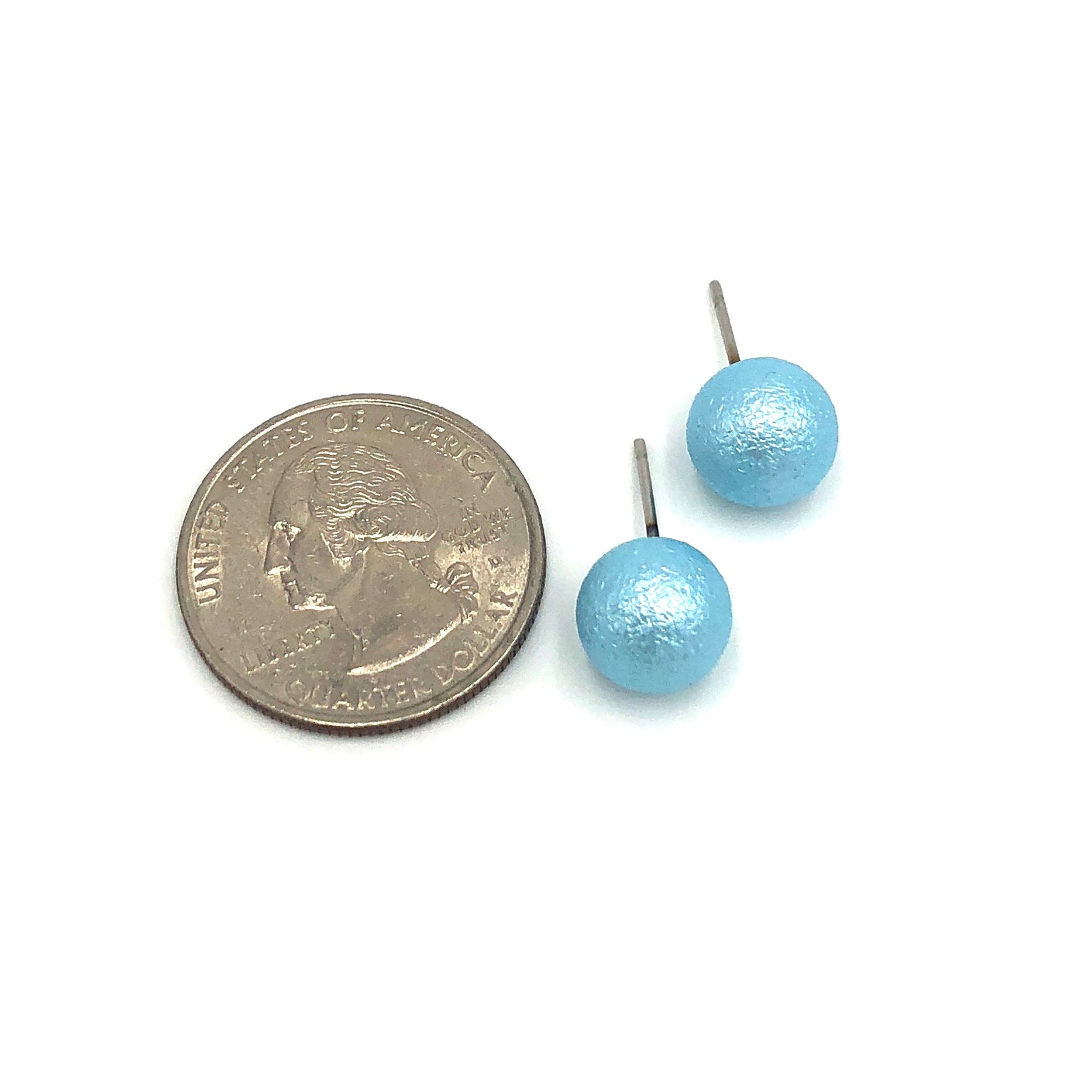 aqua pitted ball stud earrings with quarter in photo to show size