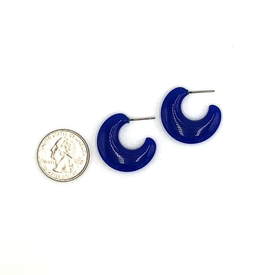 quarter in picture with deep blue flat hoop earrings to show size