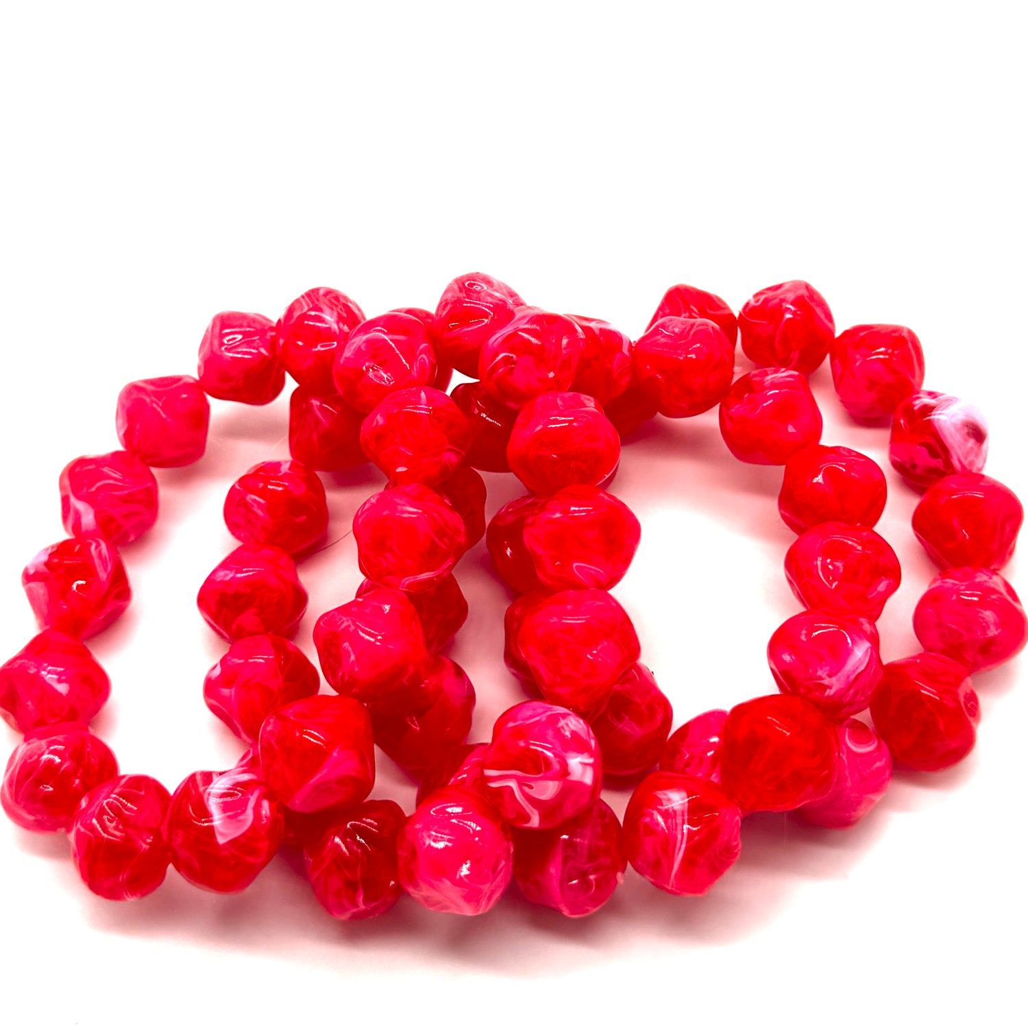 String of red beads on a white background