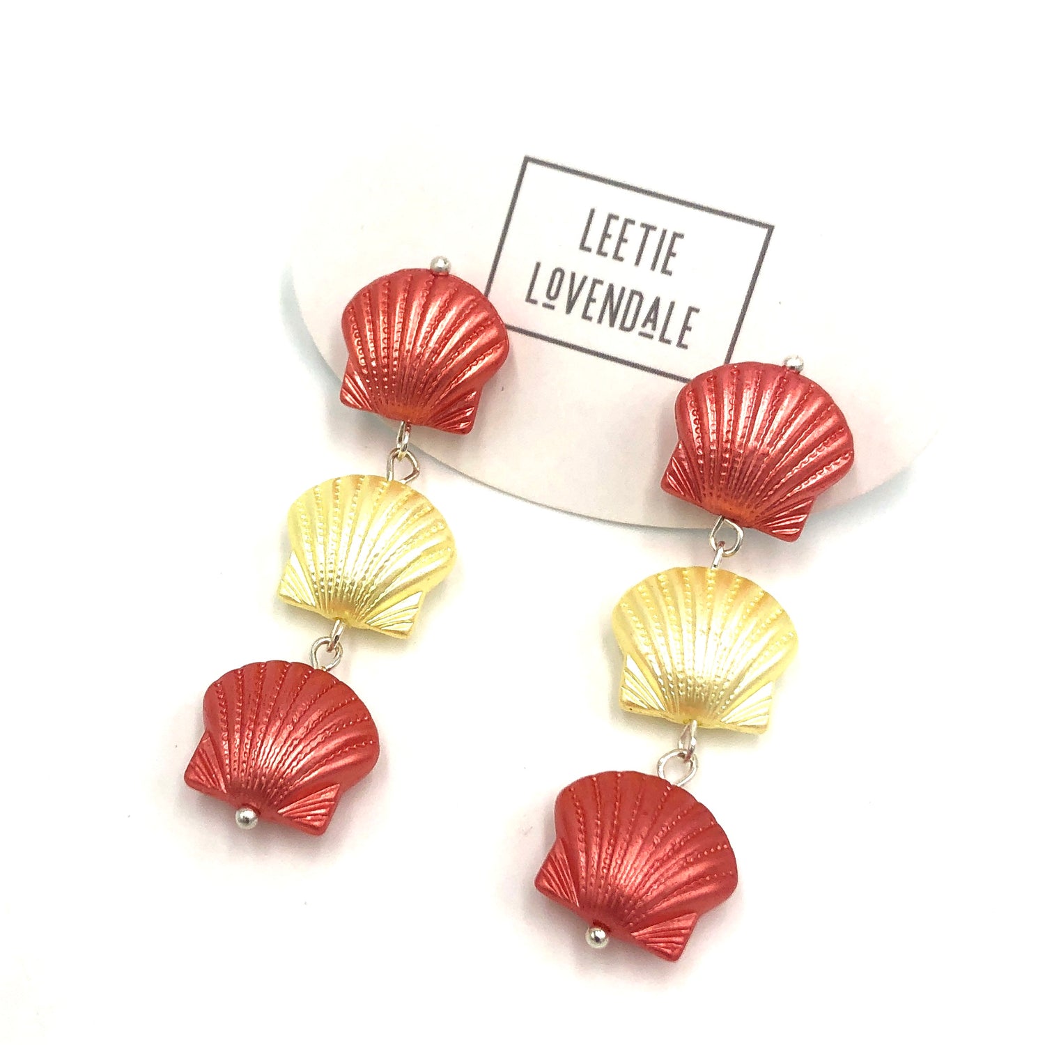 coral and yellow seashell style earrings