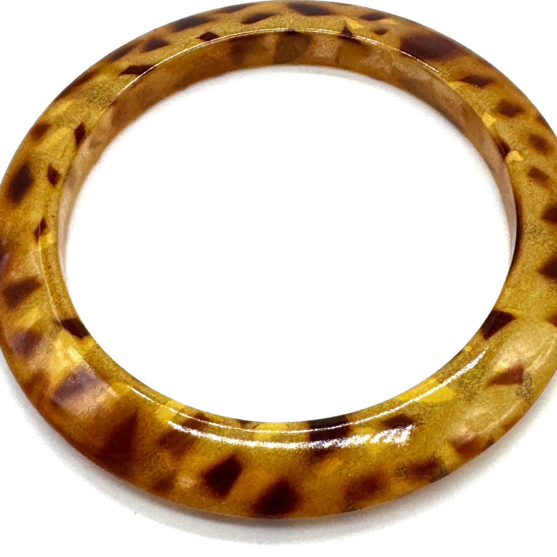 Tortoiseshell bangle on a white background