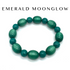 Green beaded bracelet on a white background with &