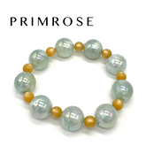 Beaded bracelet with white and gold beads on a white background, featuring the brand &
