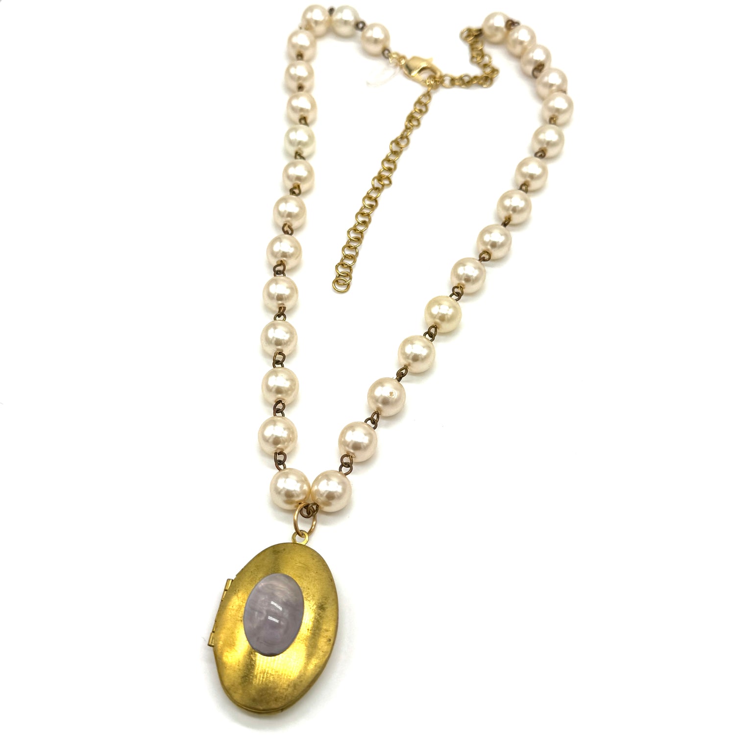 Pearl necklace with a gold locket on a white background