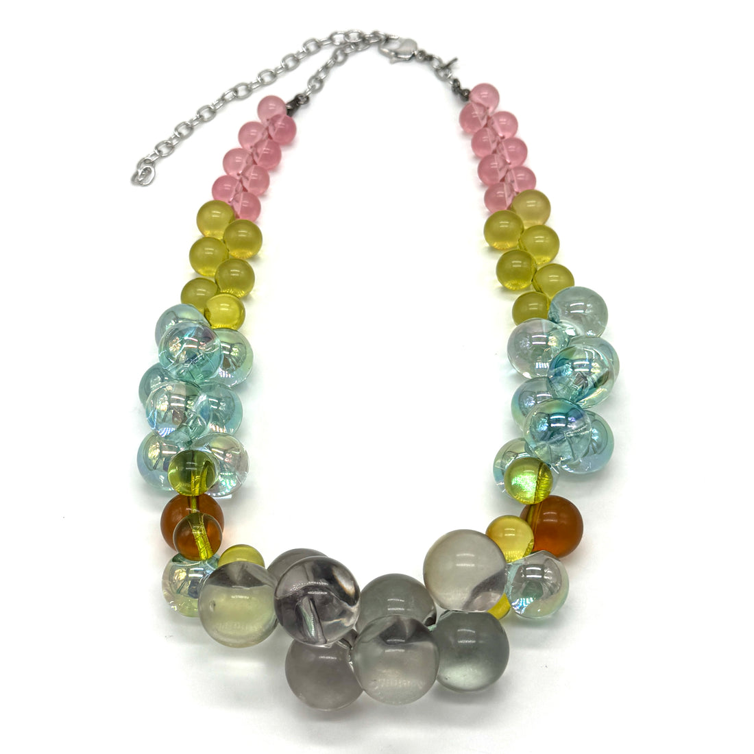 Multicolored bauble necklace on a white background.