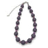 Adjustable necklace featuring dark gray and lilac lucite beads laid on a white background.