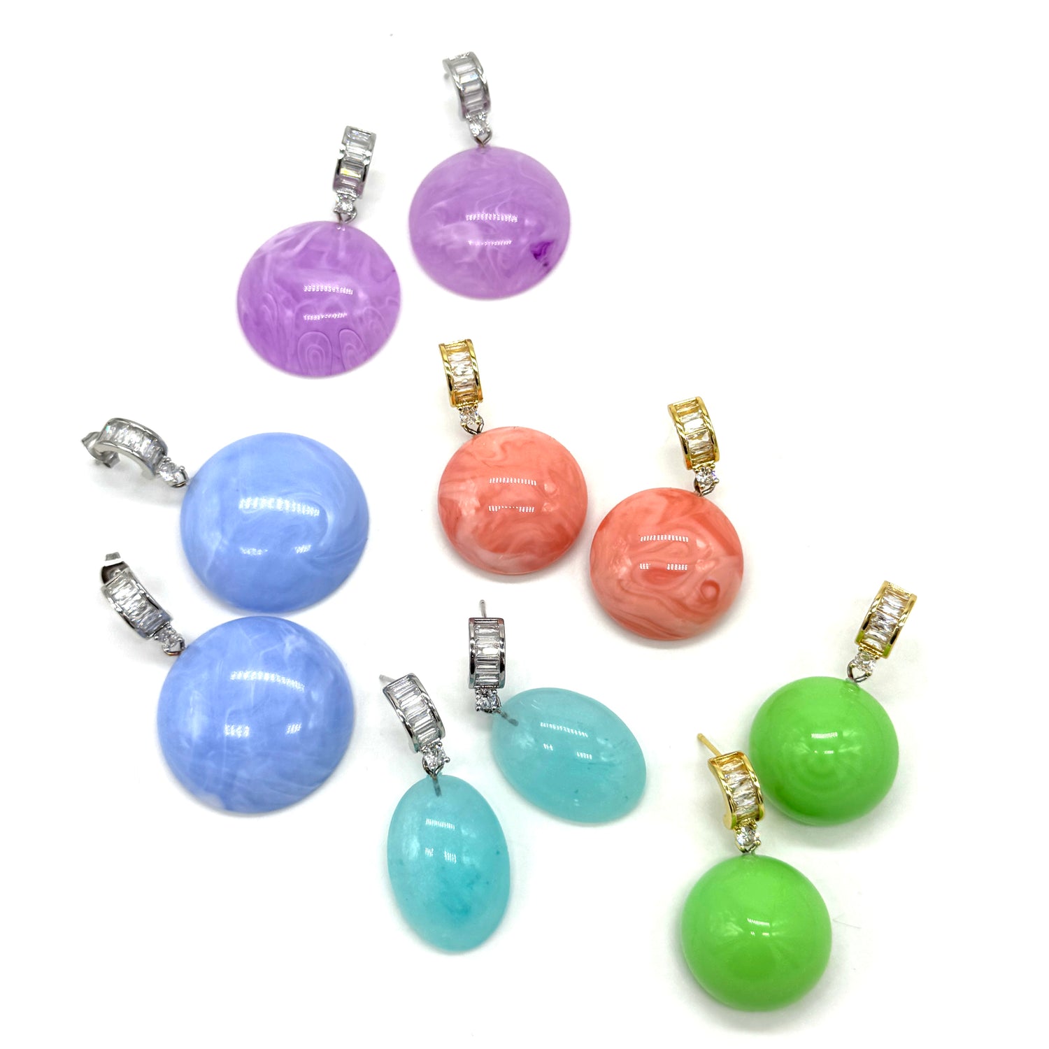 Brightly colored lucite earrings on a white background.