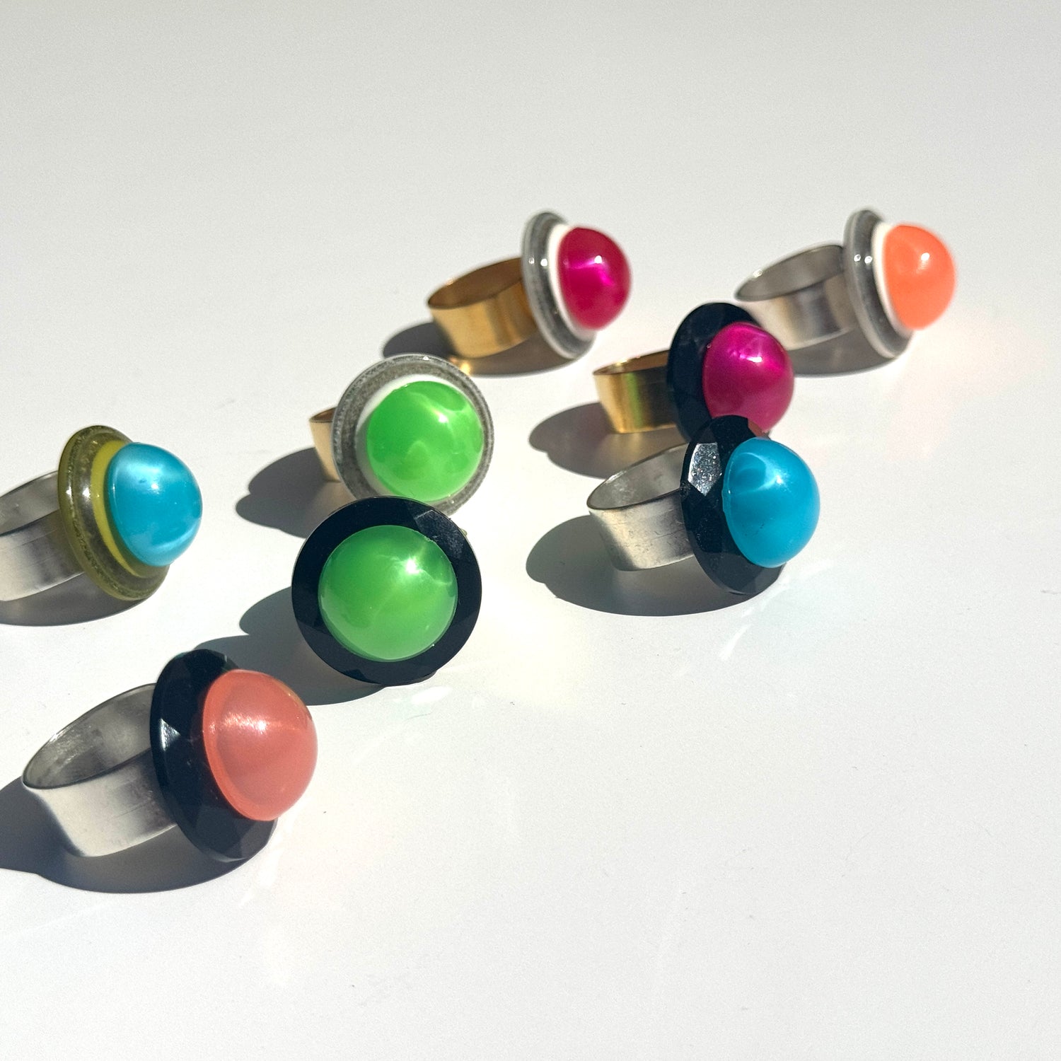 Set of colorful ring earrings on a white background